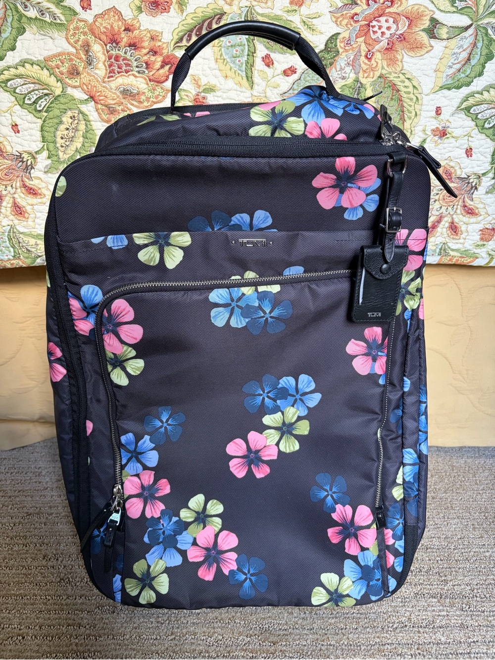 Tumi Black Suitcase with Pink, Blue, & Green Floral Print